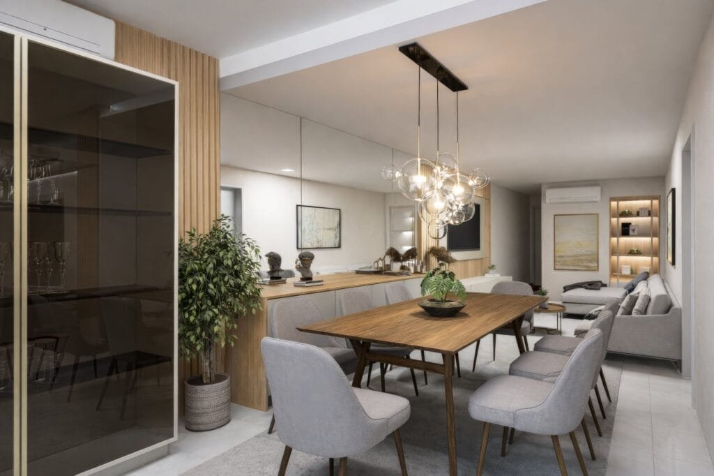Sala de jantar integrada com lustre moderno projetada por escritório de arquitetura Palhoça.