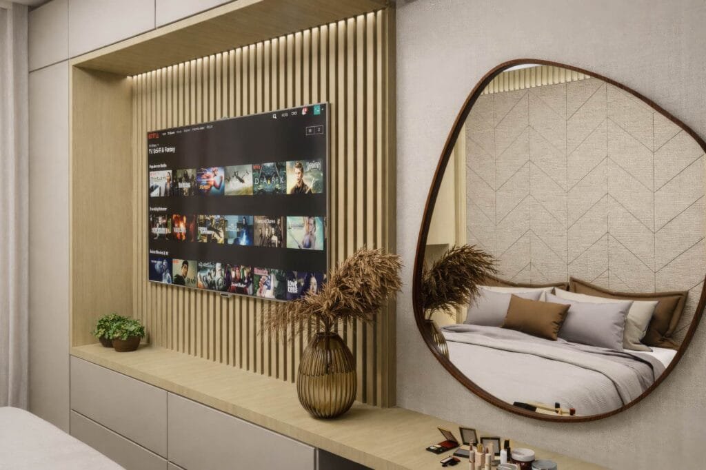 Painel ripado de TV e penteadeira com espelho orgânico em suíte planejada por arquiteto em Palhoça.