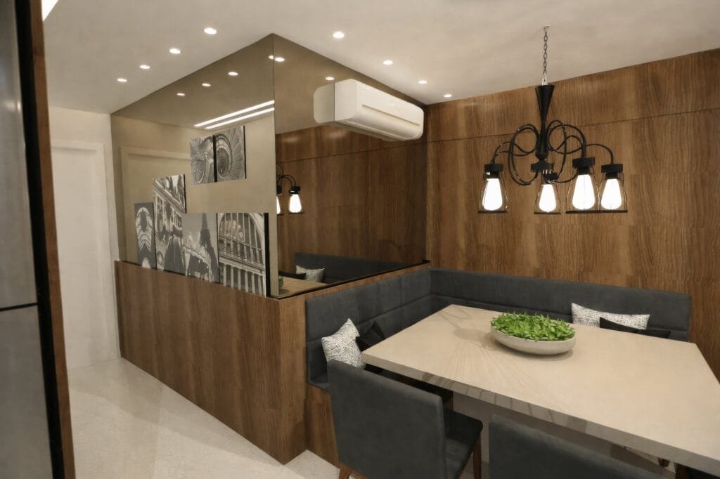 Sala de jantar com canto alemão estofado e espelho bronze projetada por arquiteto Garopaba.